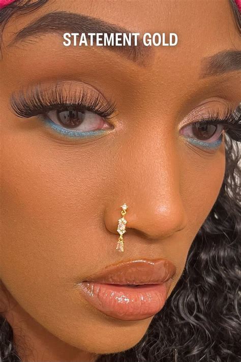 statement gold nose rings.